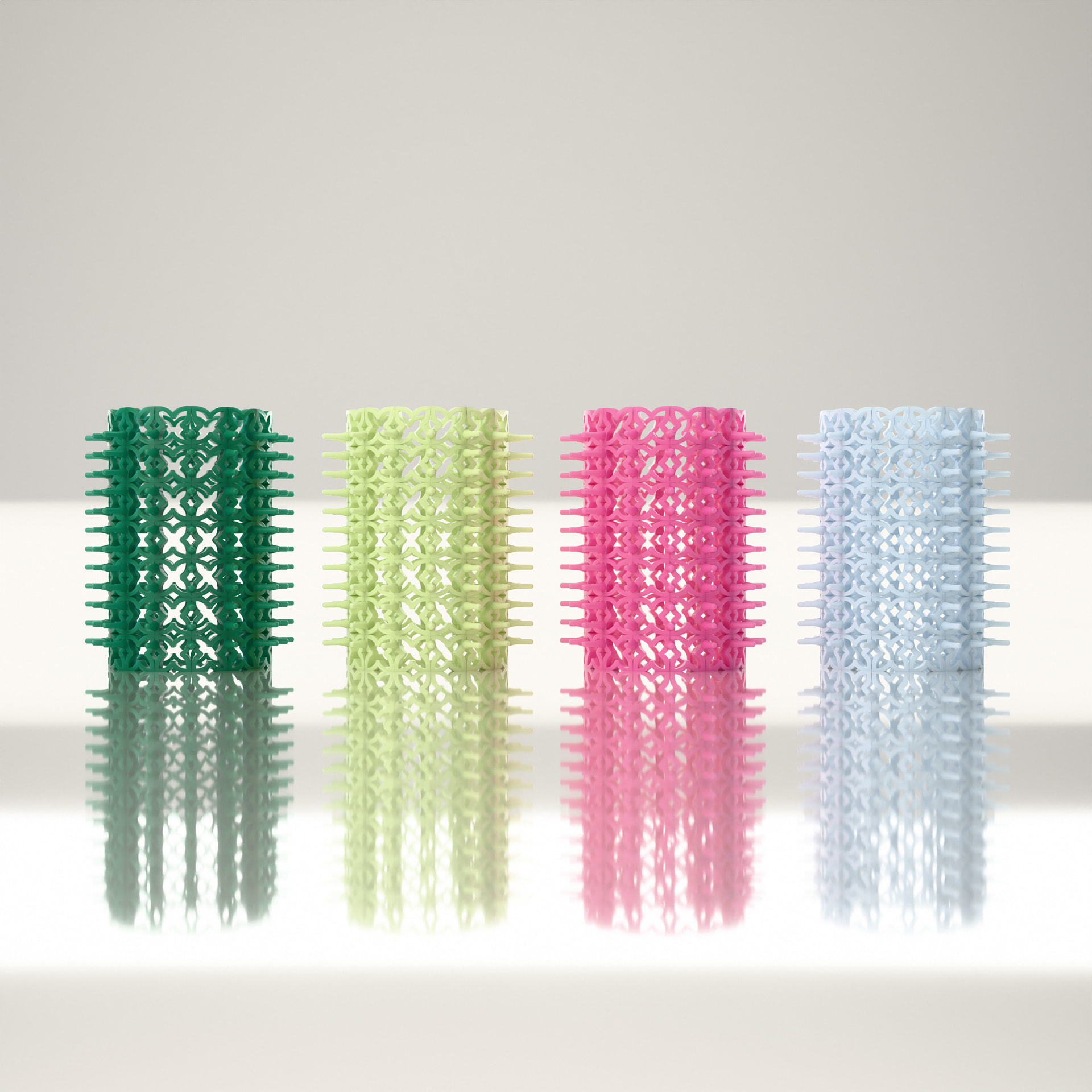 Four Crazy Curlers in the collection colours reflected on a glossy surface
