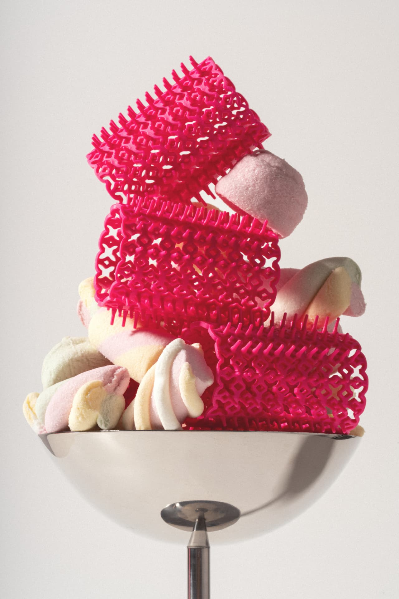 Crazy Curlers campaign photograph: orange box with pink rollers and marshmallows